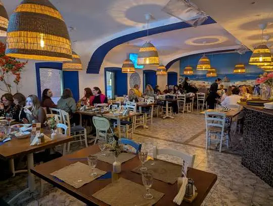 the taverna's dining room during an evening